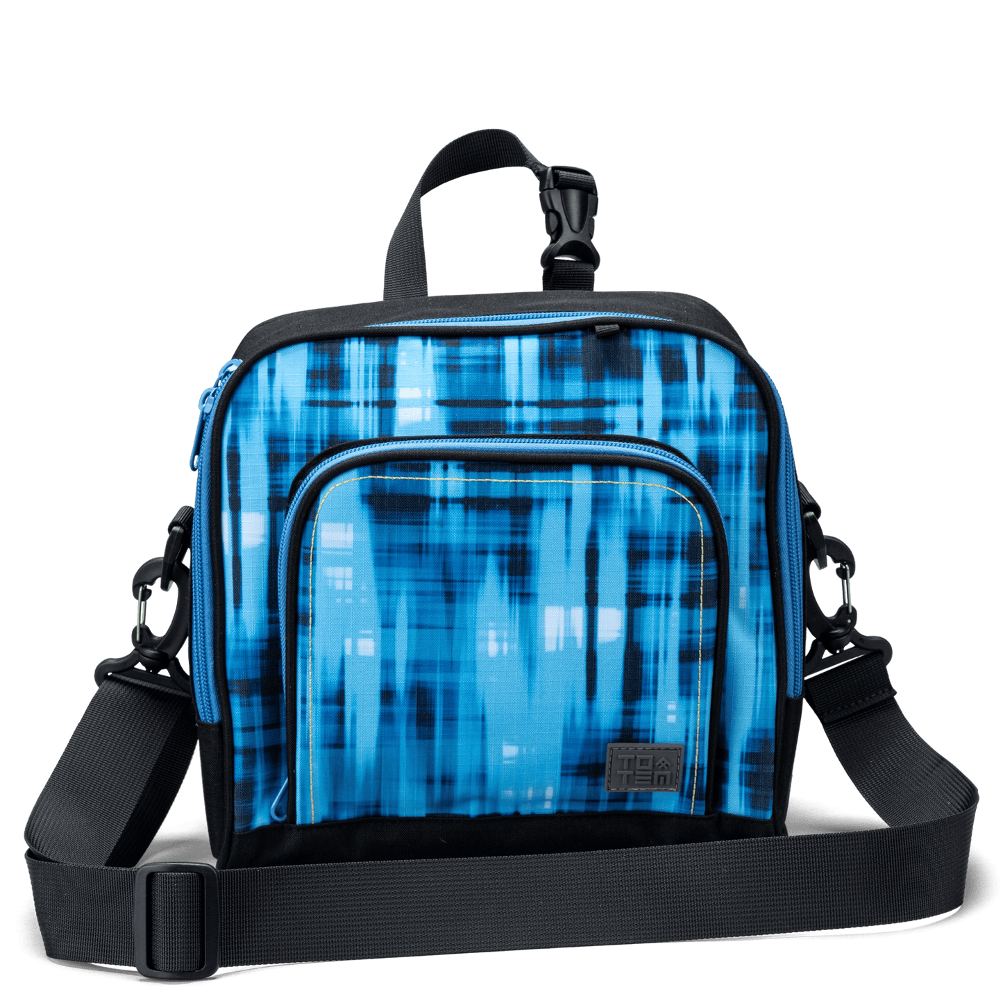 The front pocket on a blue geometric Totem lunch bag with a detachable shoulder strap.
