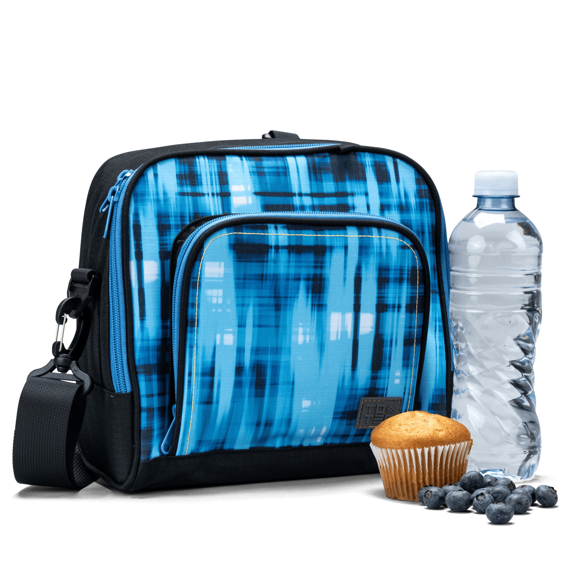 The front pocket on the blue geometric Totem lunch bag has a water bottle and a muffin.