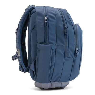 A side view of a navy blue Totem school backpack featuring three zippered compartments, and padded shoulder straps.