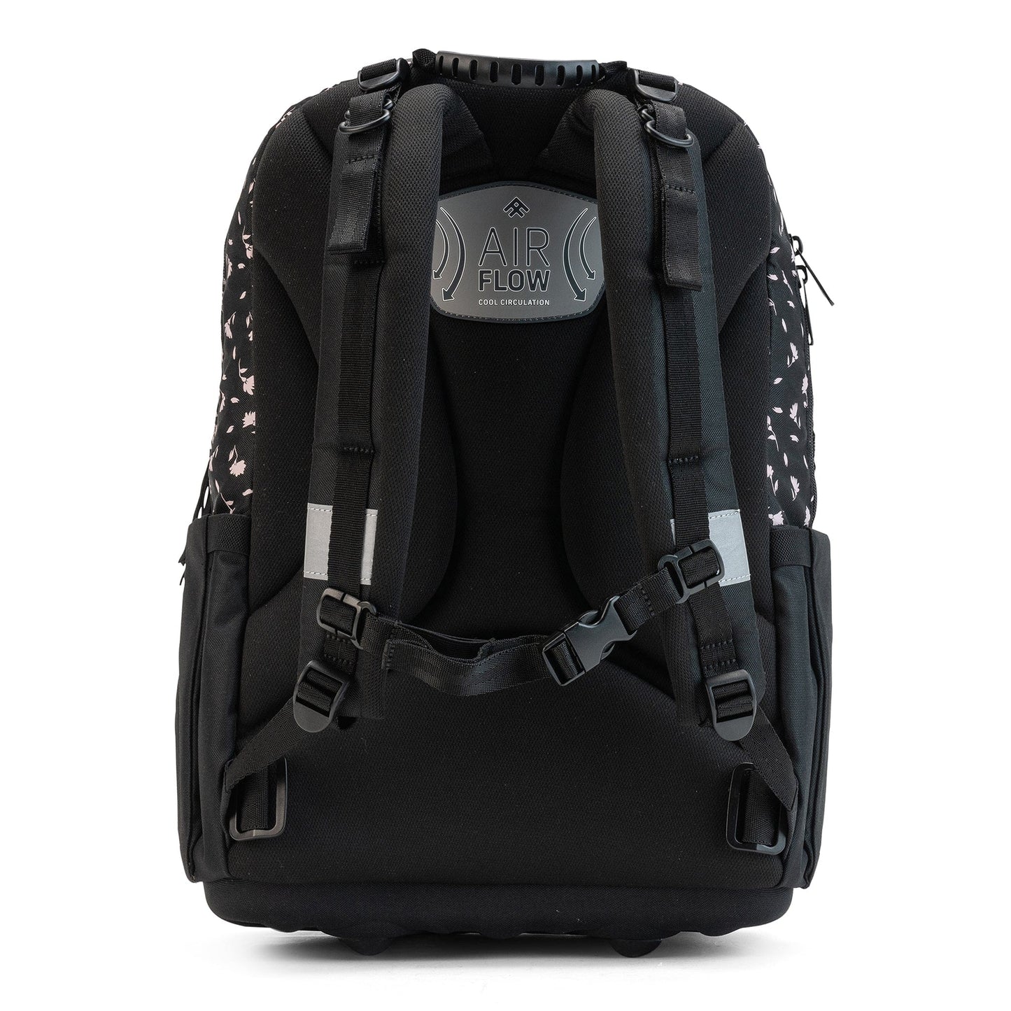 The back view of a black floral school bag with padded straps, airflow panel, and adjustable chest buckle.