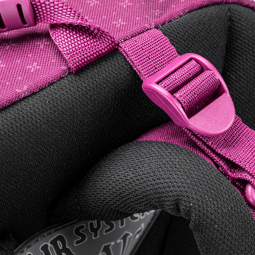 A close-up of the purple school backpack padded strap and adjustment buckle against the black ergonomic back panel.