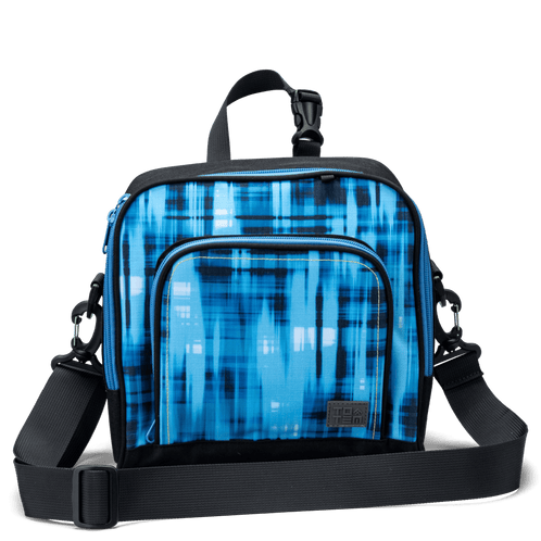 The front pocket on a blue geometric Totem lunch bag with a detachable shoulder strap.