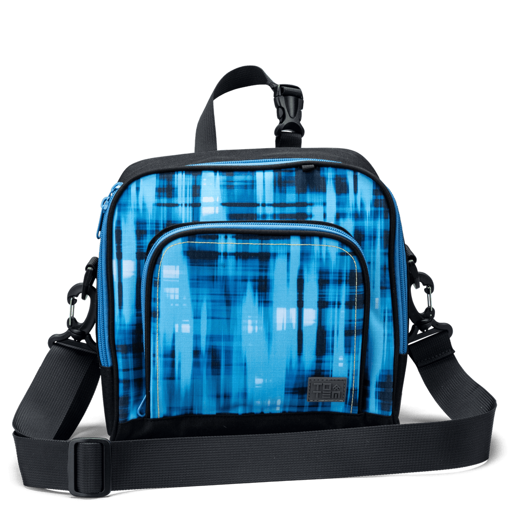 The front pocket on a blue geometric Totem lunch bag with a detachable shoulder strap.