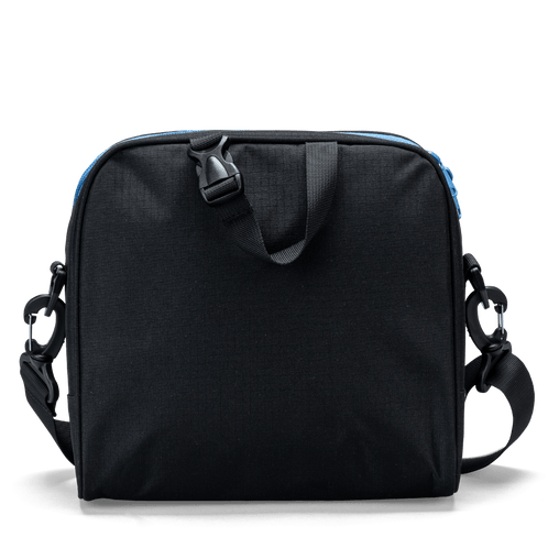 The carry handle on a black Totem lunch bag with detachable shoulder-strap clips.