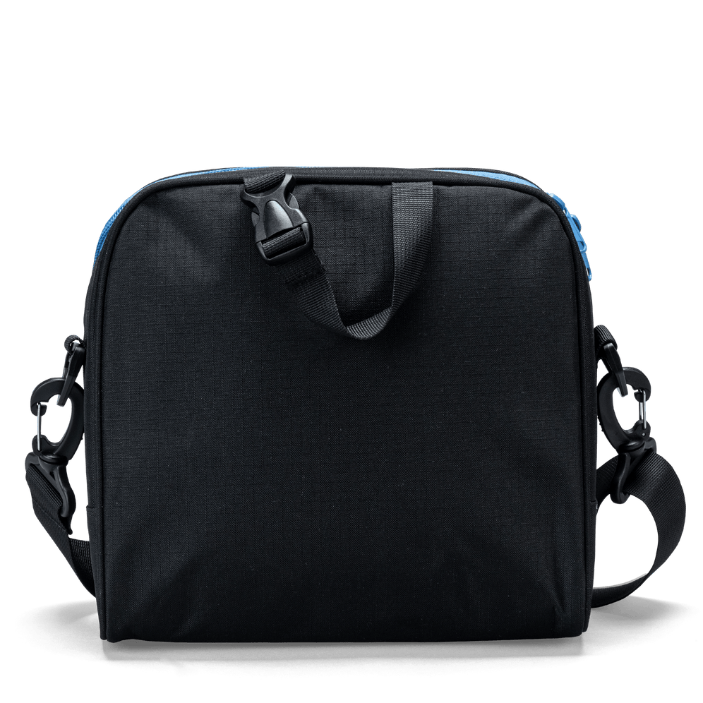 The carry handle on a black Totem lunch bag with detachable shoulder-strap clips.