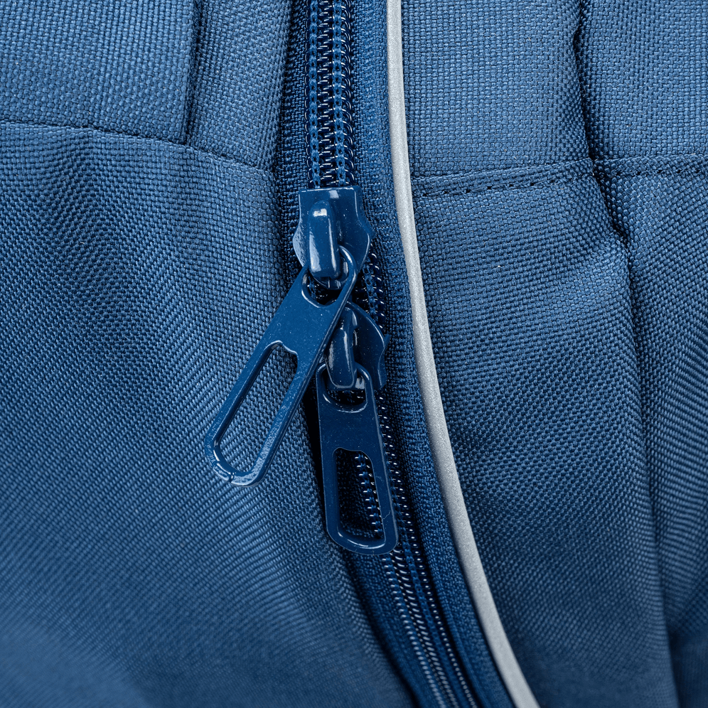 A close up of zips found on a Navy trolley bag with wheels.