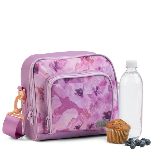 The front three-quarter view of the lilac Totem insulated lunch bag with a watercolour print, showing a bottle and snacks.