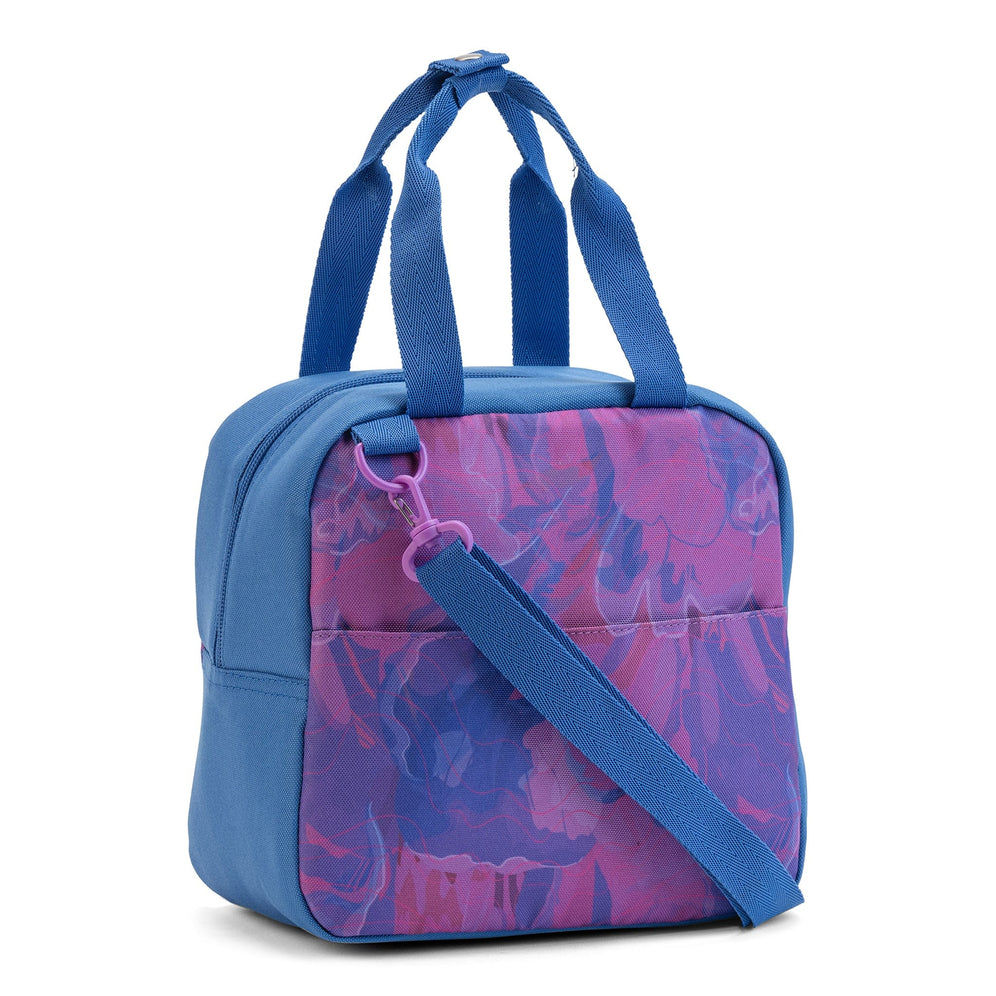 The three-quarter back view of Savvy lunch bag in blue and purple with back slip pocket and shoulder strap.