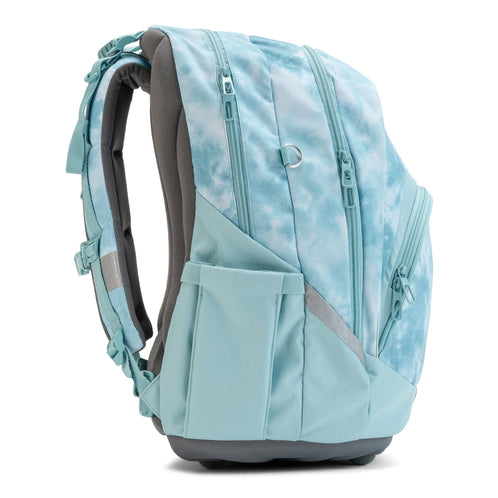 A side view of an ergonomic tie-dye school backpack showing its multiple zip compartments and water bottle pocket.