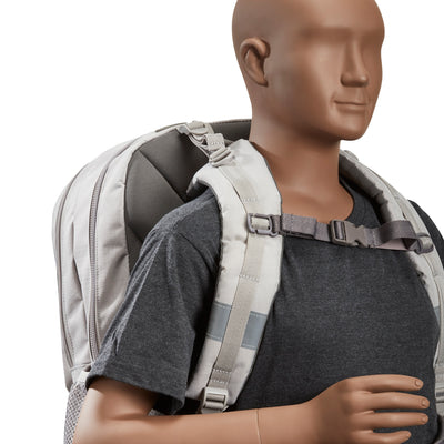 A grey waist and chest strap to help take the load off of your back and shoulders with a dummy doll wearing the strap attached to a bag.